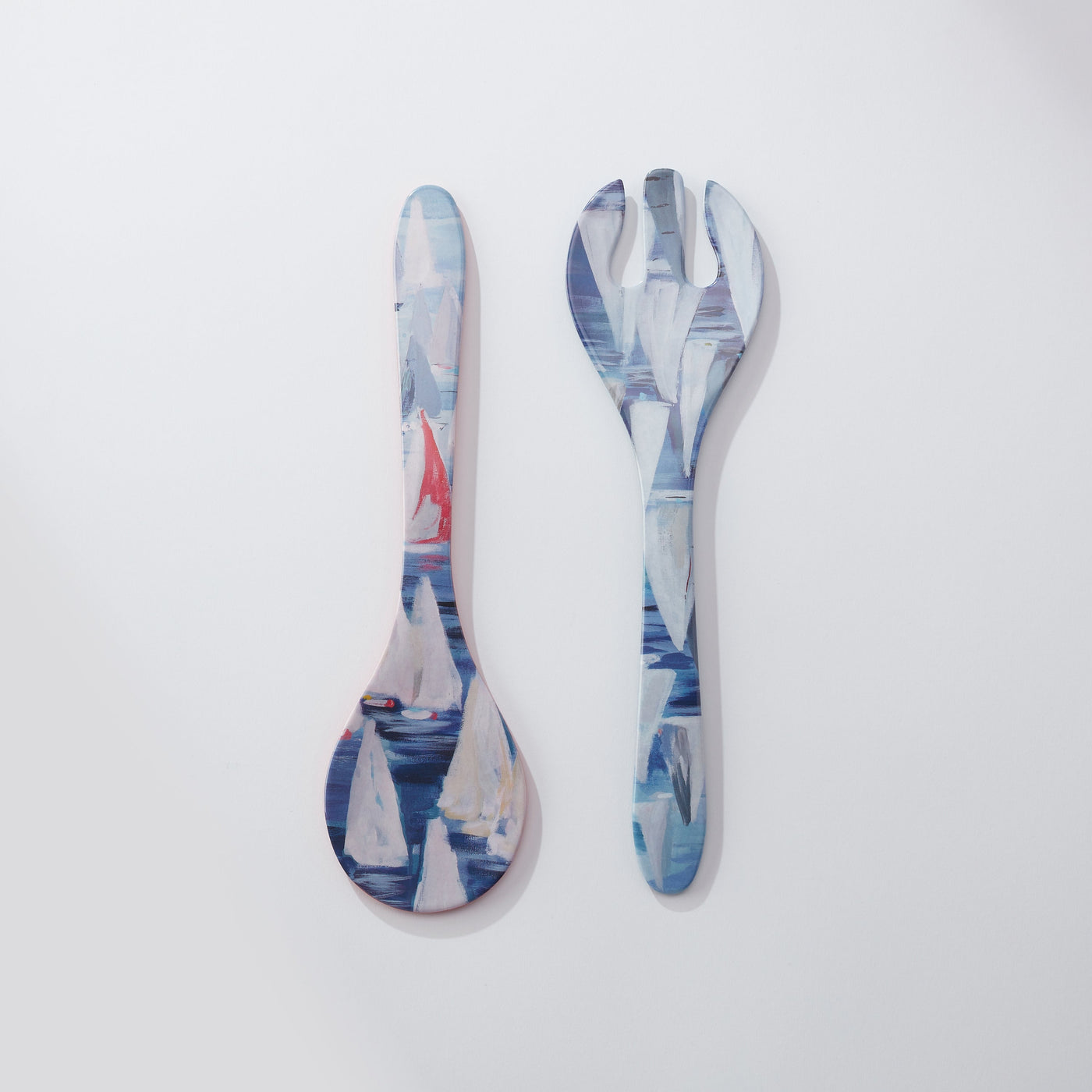 Spoon and fork set with sailboat design on a white background