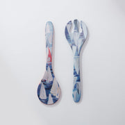 Spoon and fork set with sailboat design on a white background