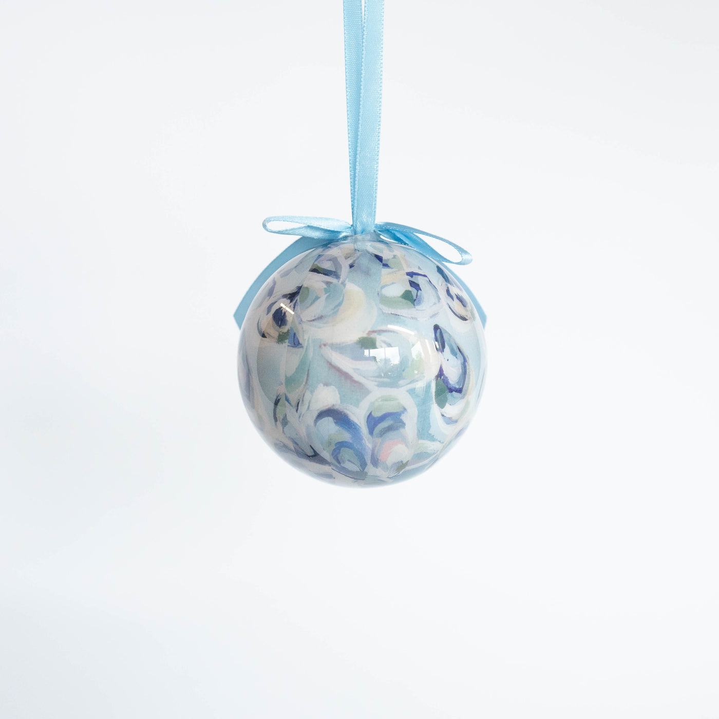 Decorative ornament ball with blue oyster pattern on a white background
