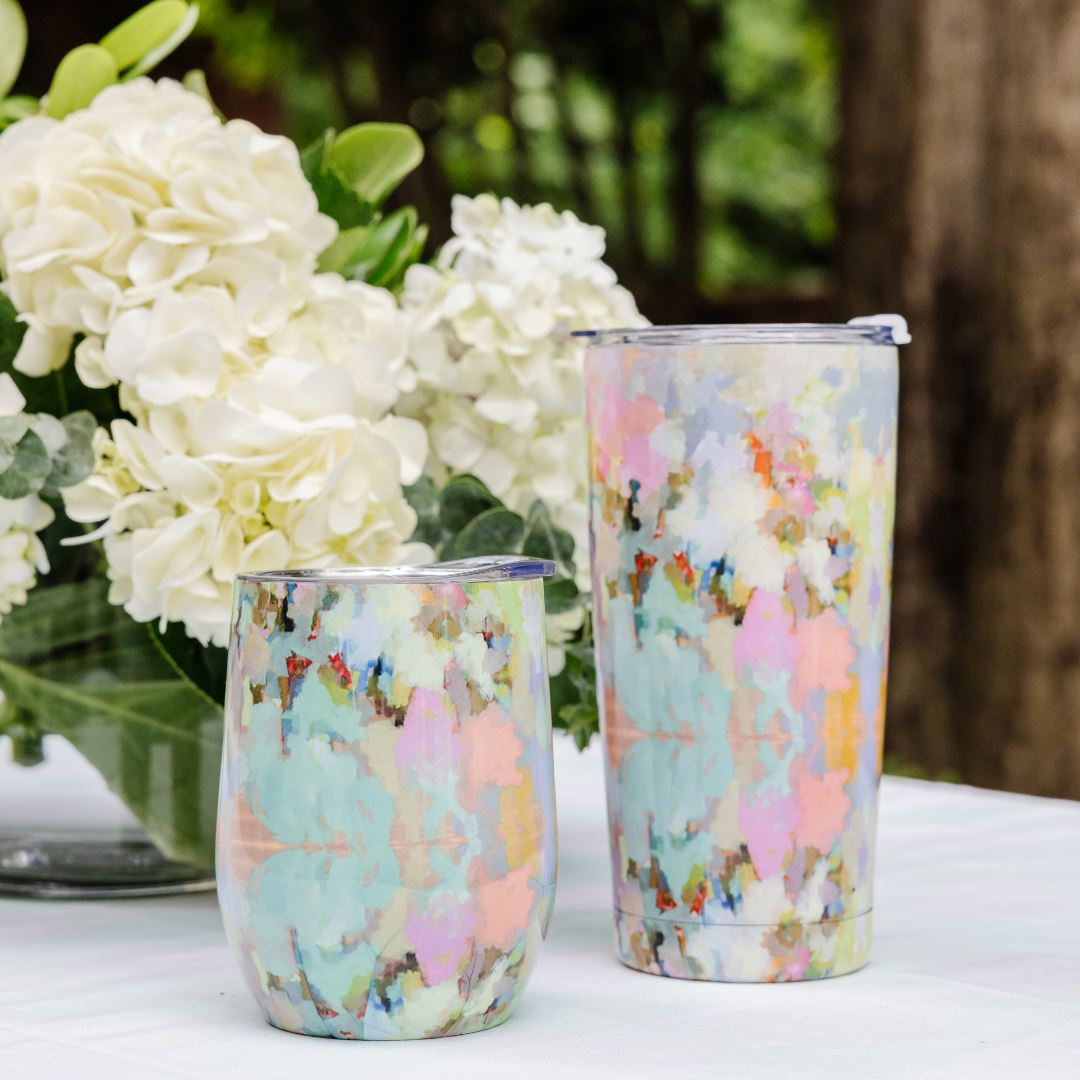 Tumbler - Stemless Wine - Brooks Avenue - 12oz.- this is a picture of the brooks avenue design wine tumbler next to the brooks ave taller tumbler with white flowers in the background 