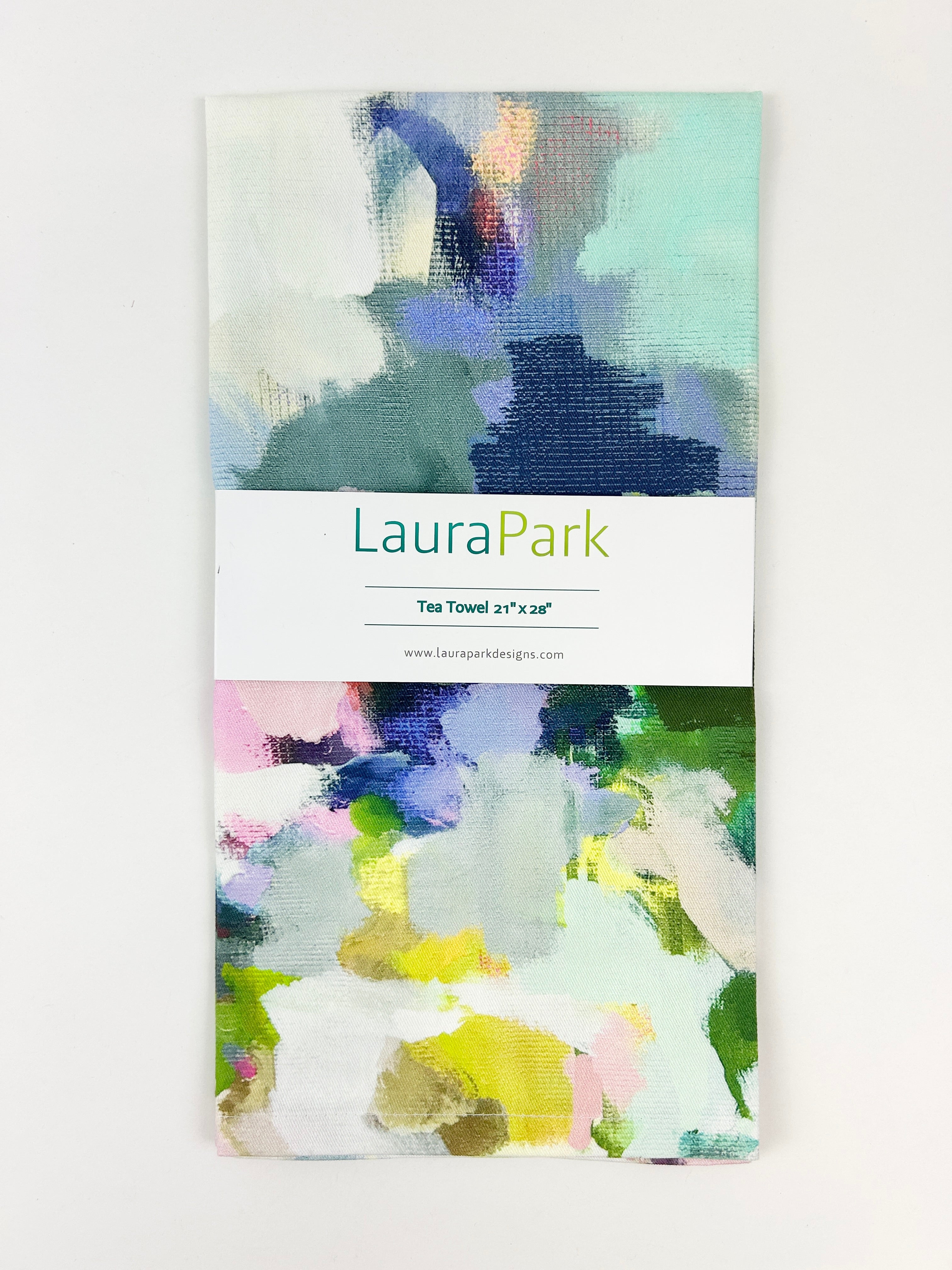 Tea Towel - Park Avenue- this is. A picture of the colorful park avenue design folded with a sign that reads “Laura Park Tea Towel 21’x38’’ “
‘
