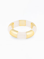 Gold and white bangle on a white background