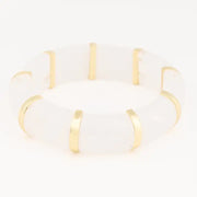 Gold and white bracelet on a white background