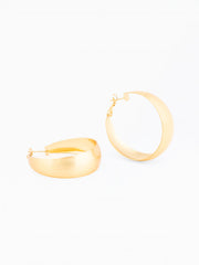 Gold hoop earrings on a white background