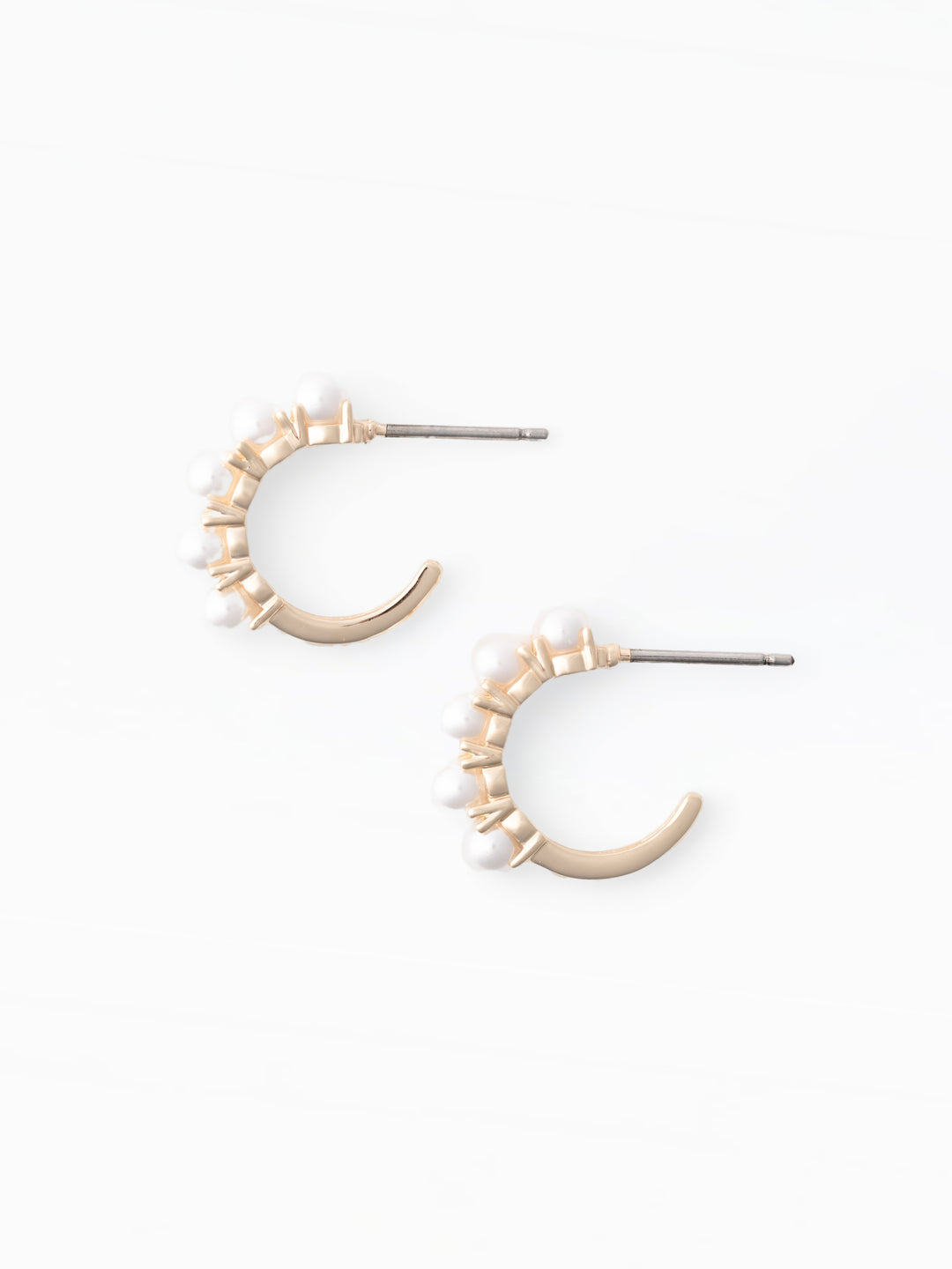 Pair of gold hoop earrings on a white background