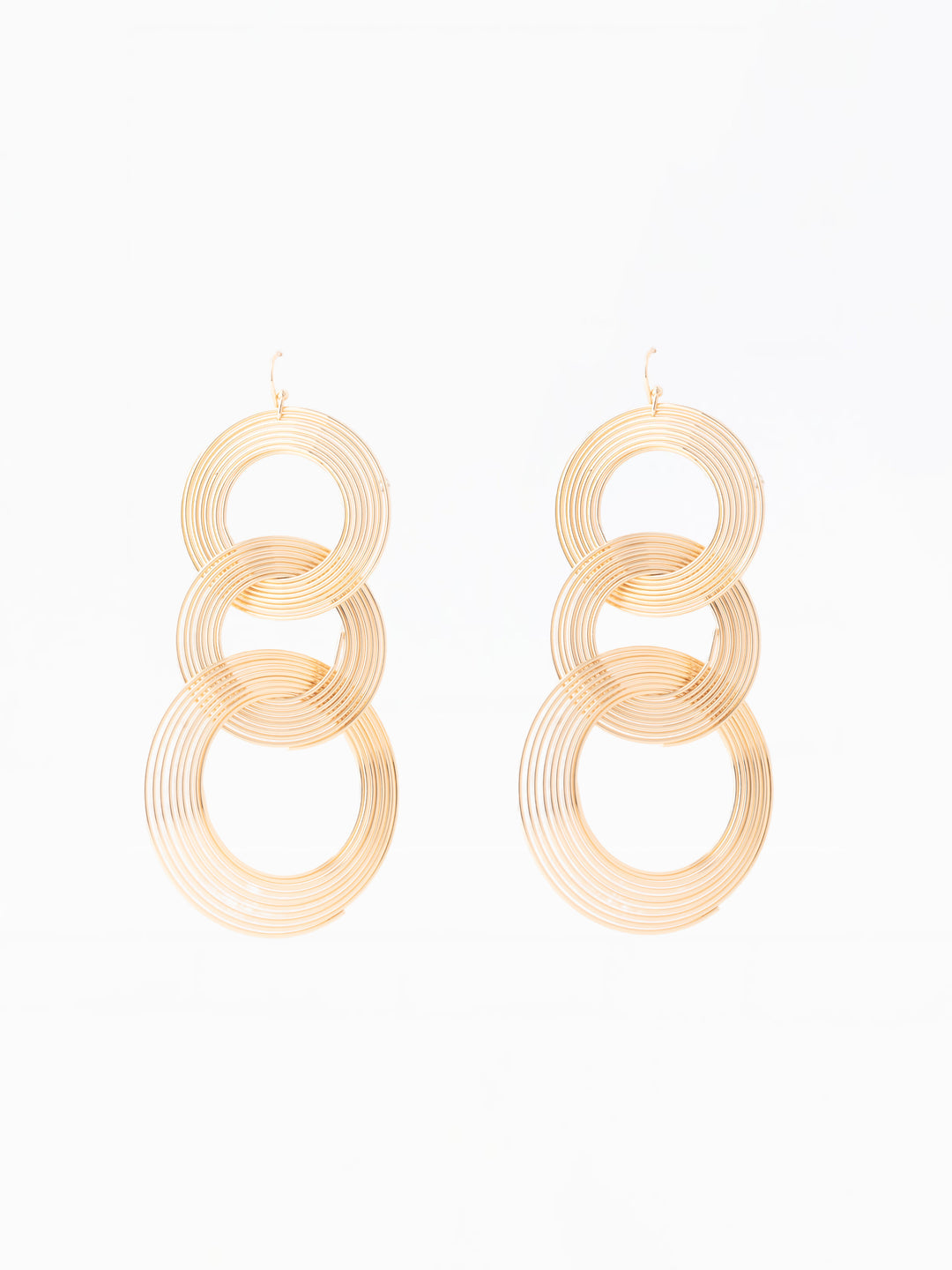 Pair of gold hoop earrings on a white background