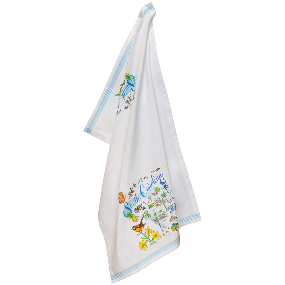 White towel with colorful scene and text on a white background