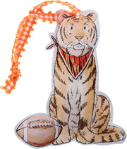 Stylized tiger acrylic ornament with a football and orange ribbon on a white background