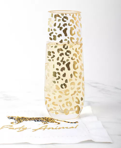 Glass - Stemless Champagne - Gold Leopard- champagne is in cheetah champagne class with a white napkin that reads “party animal” with white background 