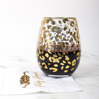 Glass - Stemless Wine - Gold Leopard- stemless wine glass has red wine in it with a napkin that reads “party animal” with a white background