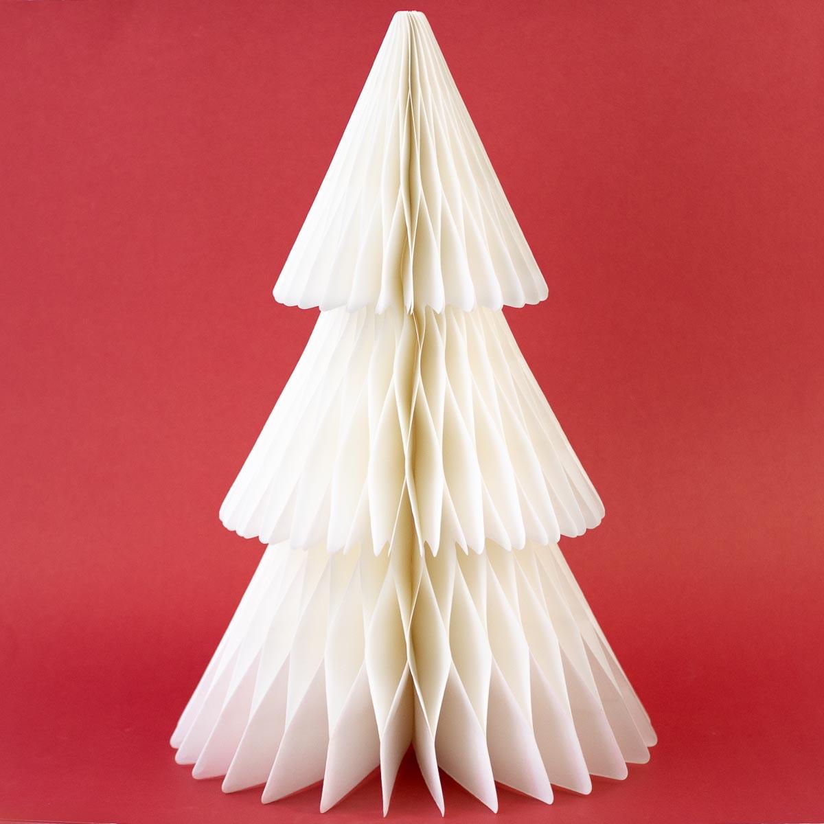 White paper Christmas tree on a red background