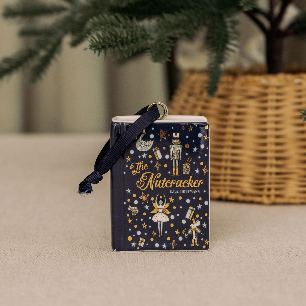 Seasonal - Ceramic  Ornament - Book shape- The Nutcracker - neutral background under a Christmas tree