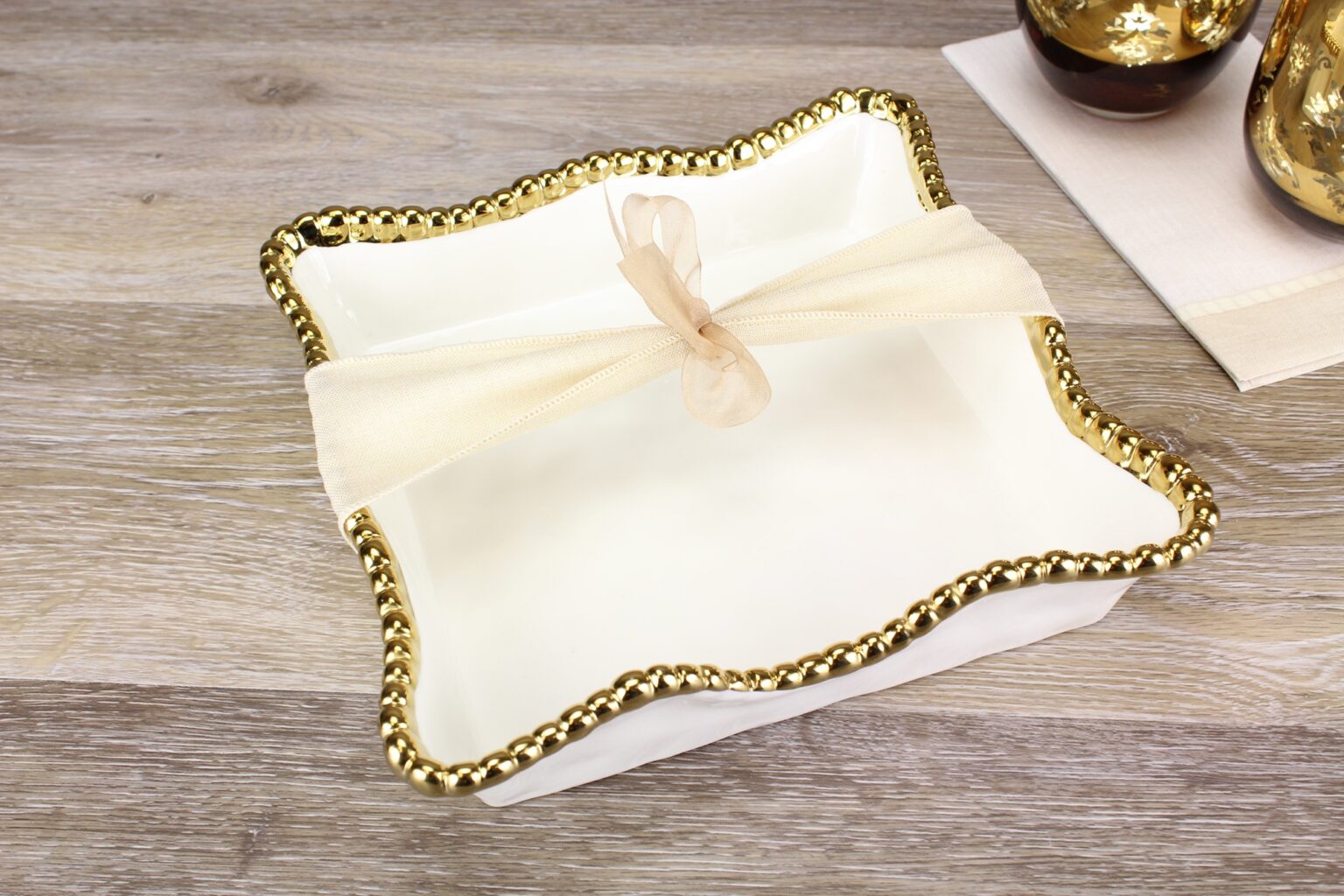 Napkin Holder - Cocktail - White with Gold Beads- white napkin holder with gold beads with a shear bow on top sitting on a wood table 