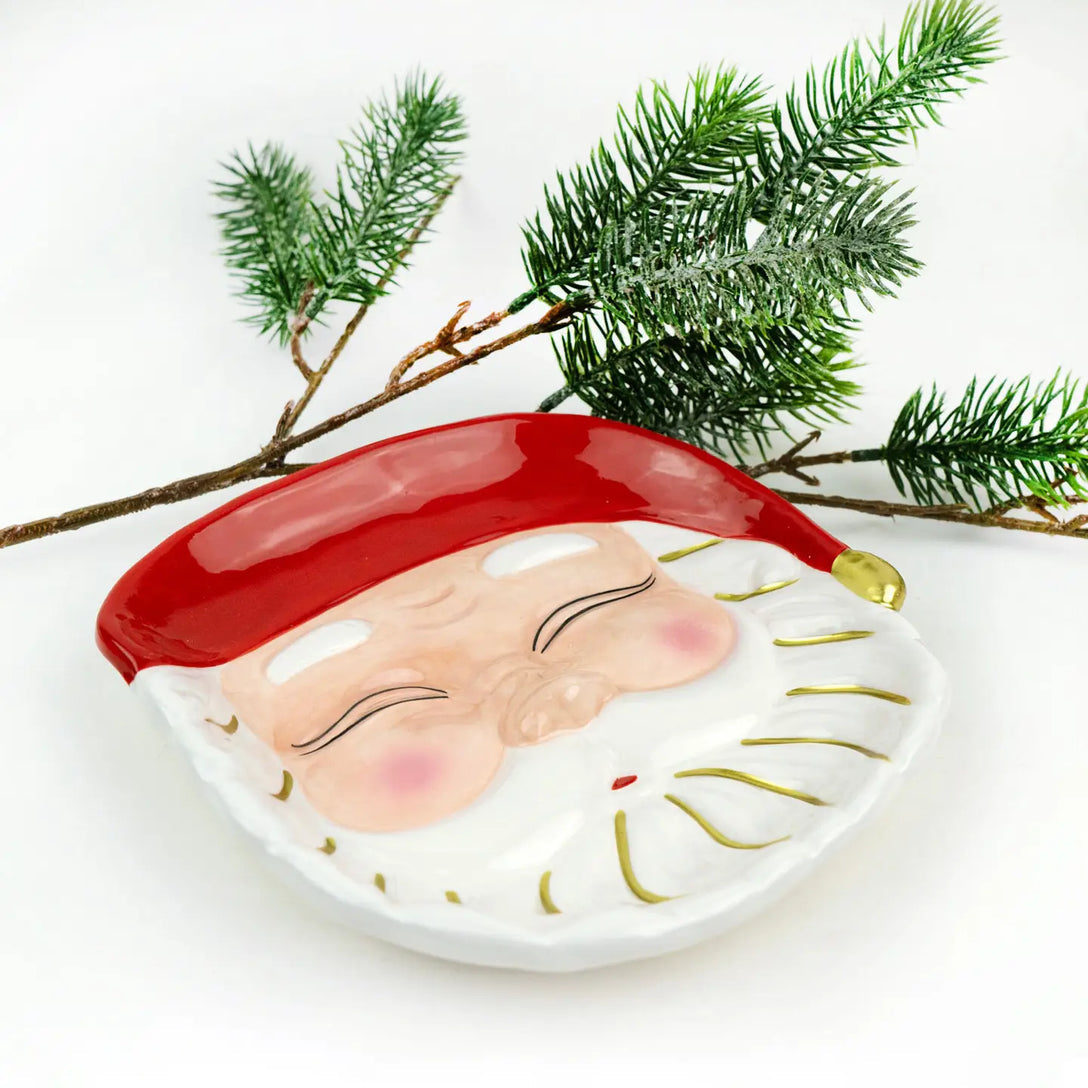 Seasonal - Plate - Dessert - Santa - Red hat with gold details.  White background with an evergreen branch behind the plate. 