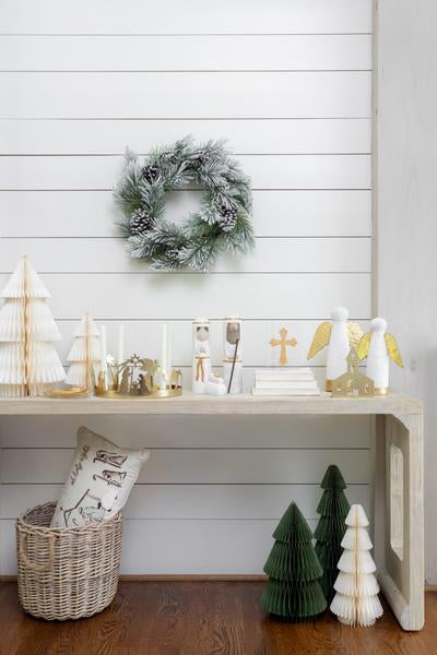 Seasonal - Pillow - Nativity - 24”x12”  ivory with nativity painted scene - pillow is in a basket under a console table decorated for Christmas 