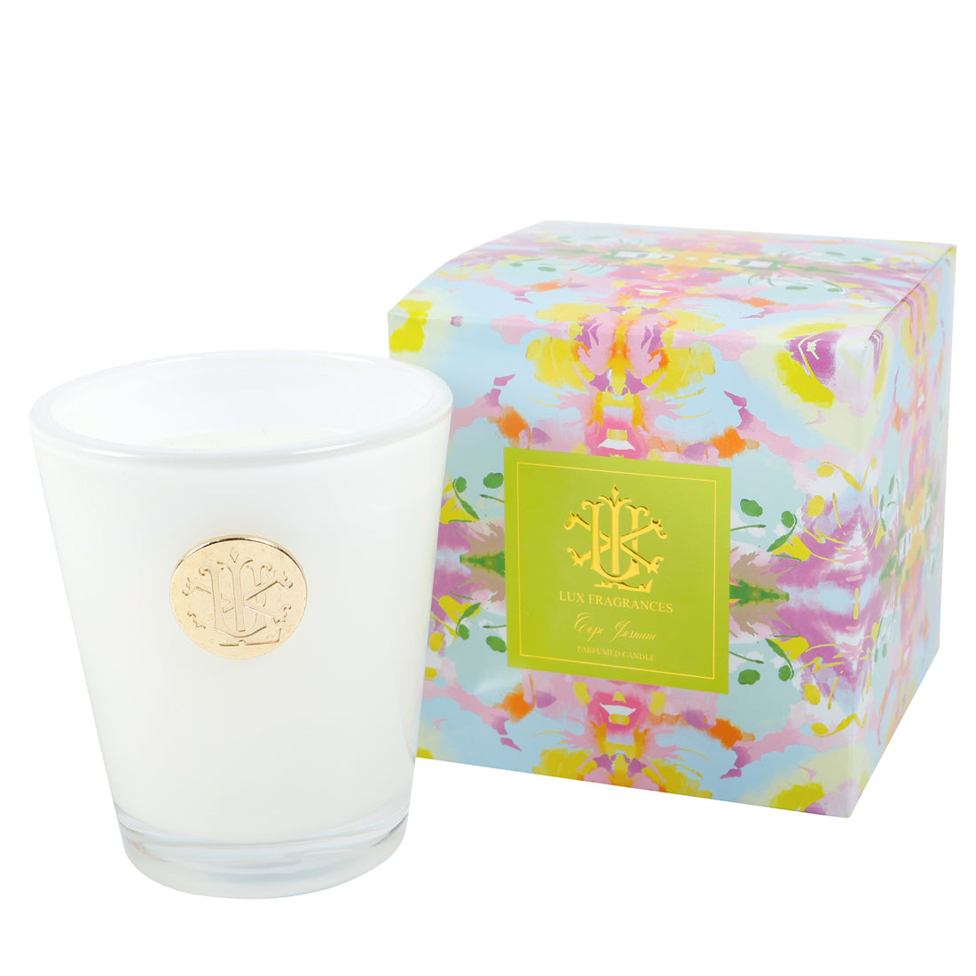 White candle in front of a floral-patterned box with a brand logo on a white background
