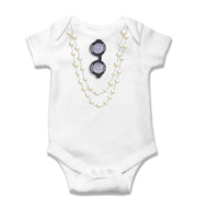 Toss Designs White baby onesie with sunglasses and pearl necklace design on a white background