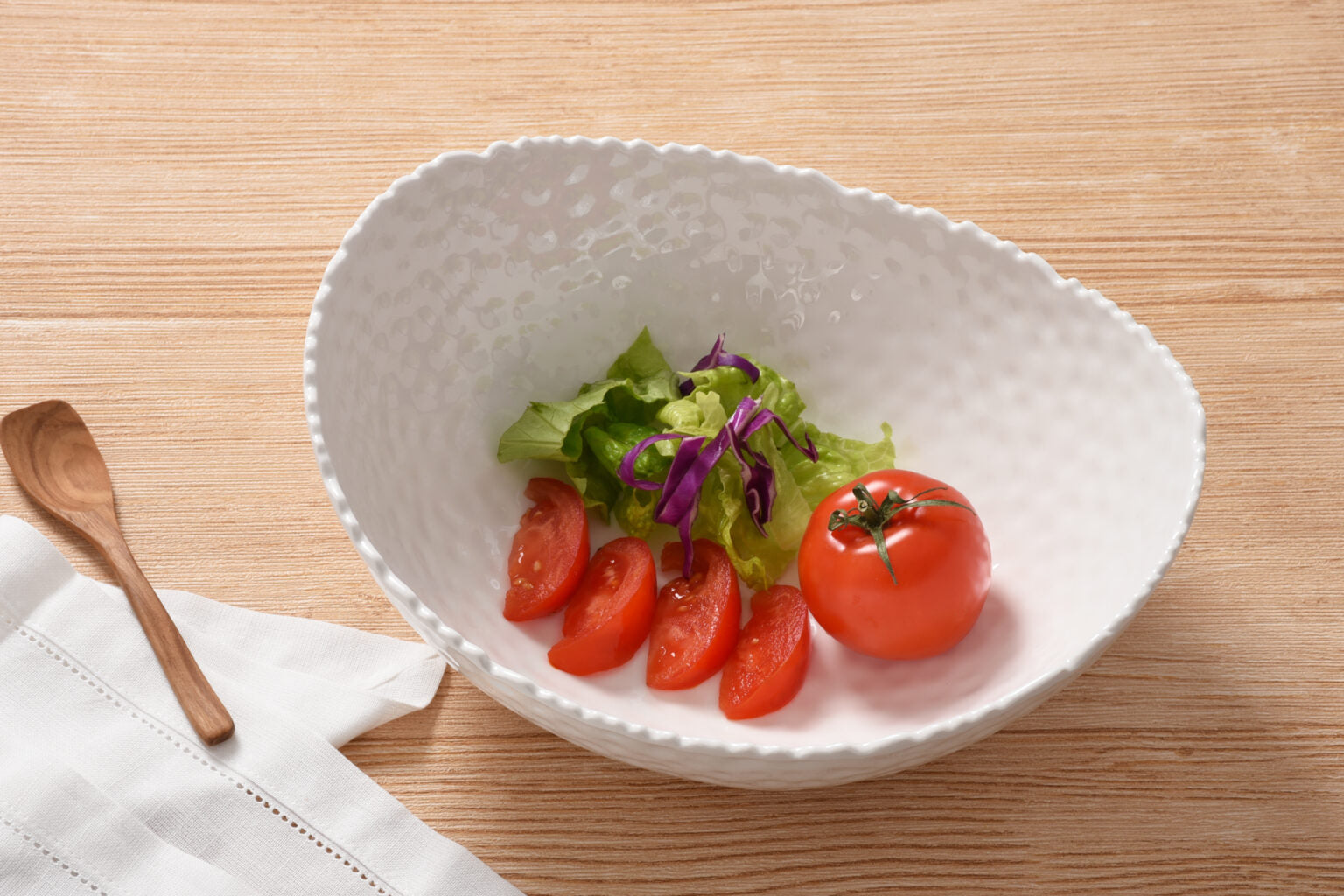 Large Oval Bowl Melamine White By Pampa Bay with salad and tomatoes on a wooden table