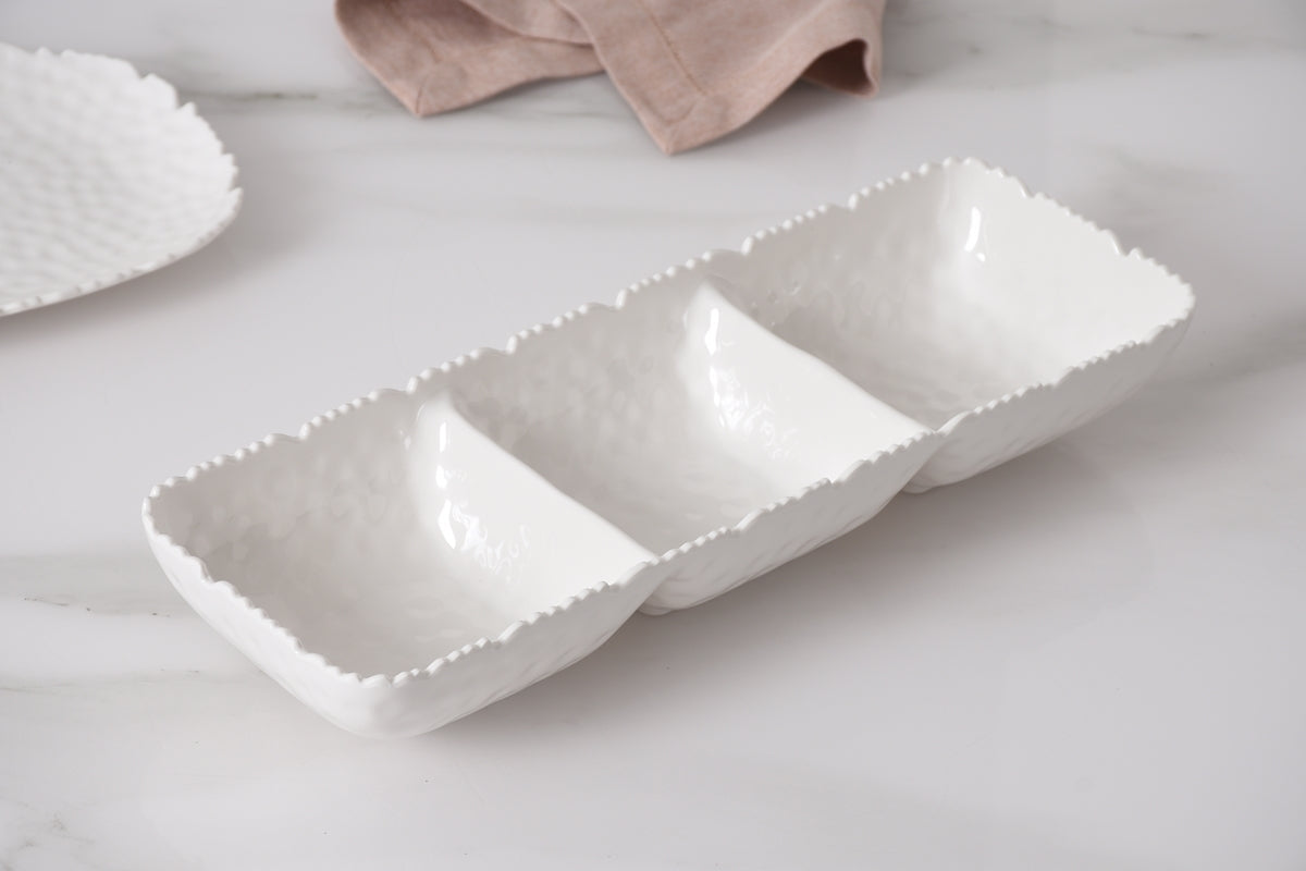 Pampa Bay White melamine 3 sectioned dish with textured rim on a light surface