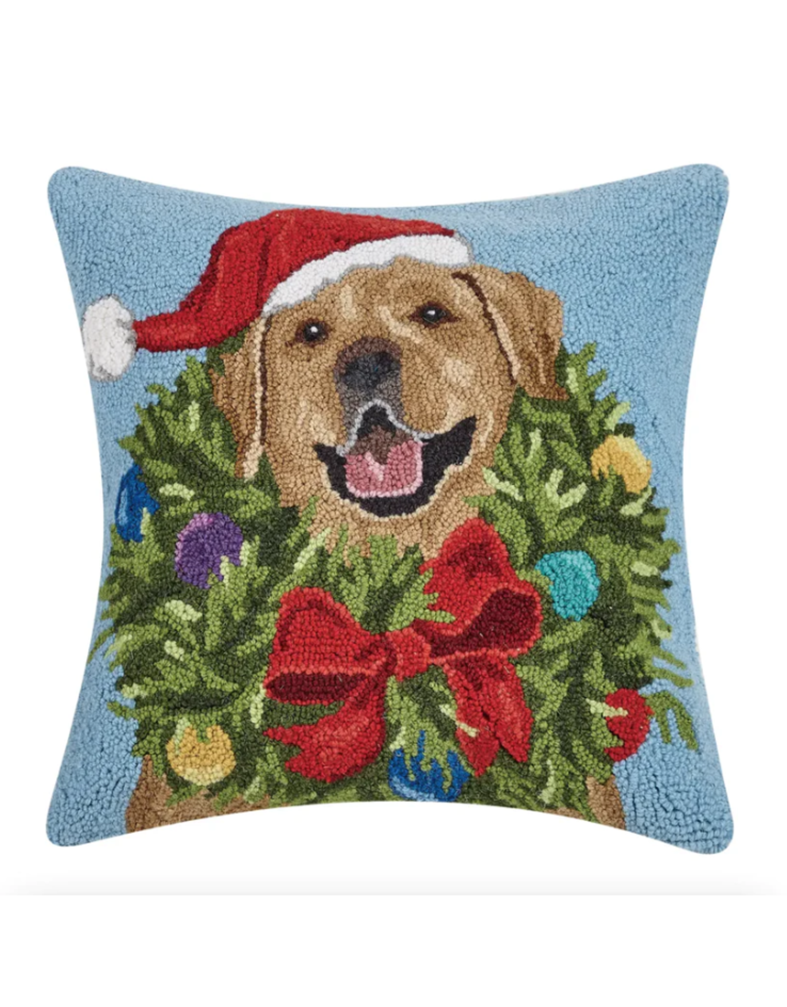 Decorative pillow with a dog wearing a Santa hat and surrounded by a Christmas wreath.