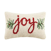 Decorative pillow with 'joy' text and Christmas elements on a white background