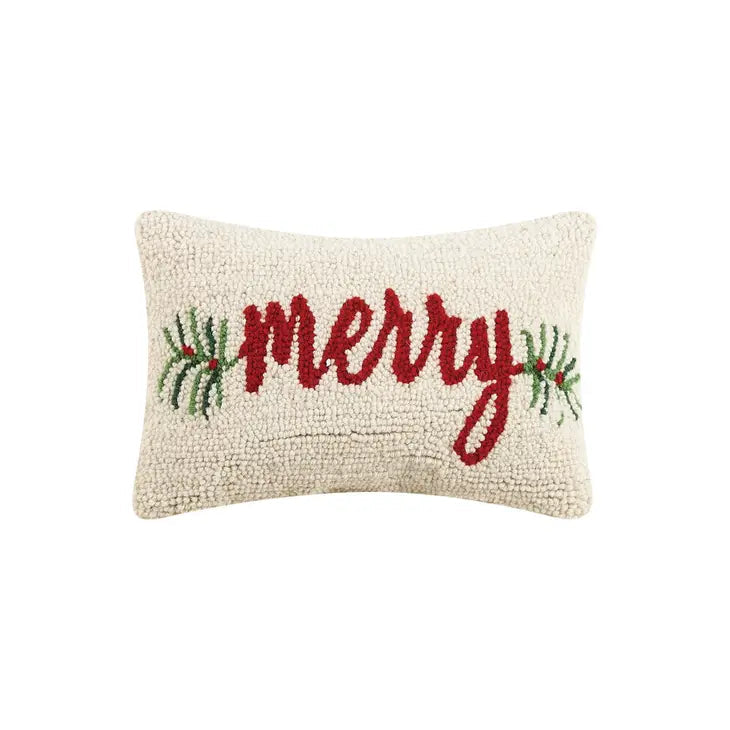 Decorative pillow with 'merry' text and Christmas tree designs on a white background
