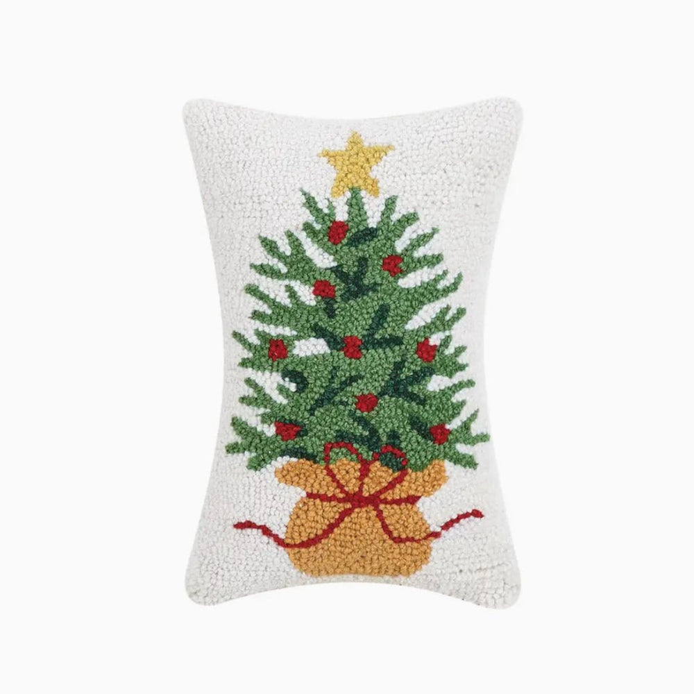 Decorative pillow with a Christmas tree design on a white background