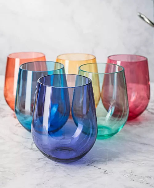 Set of colorful stemless wine glasses on a marble surface