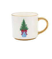 White mug with gold handle featuring a Christmas tree design on a white background