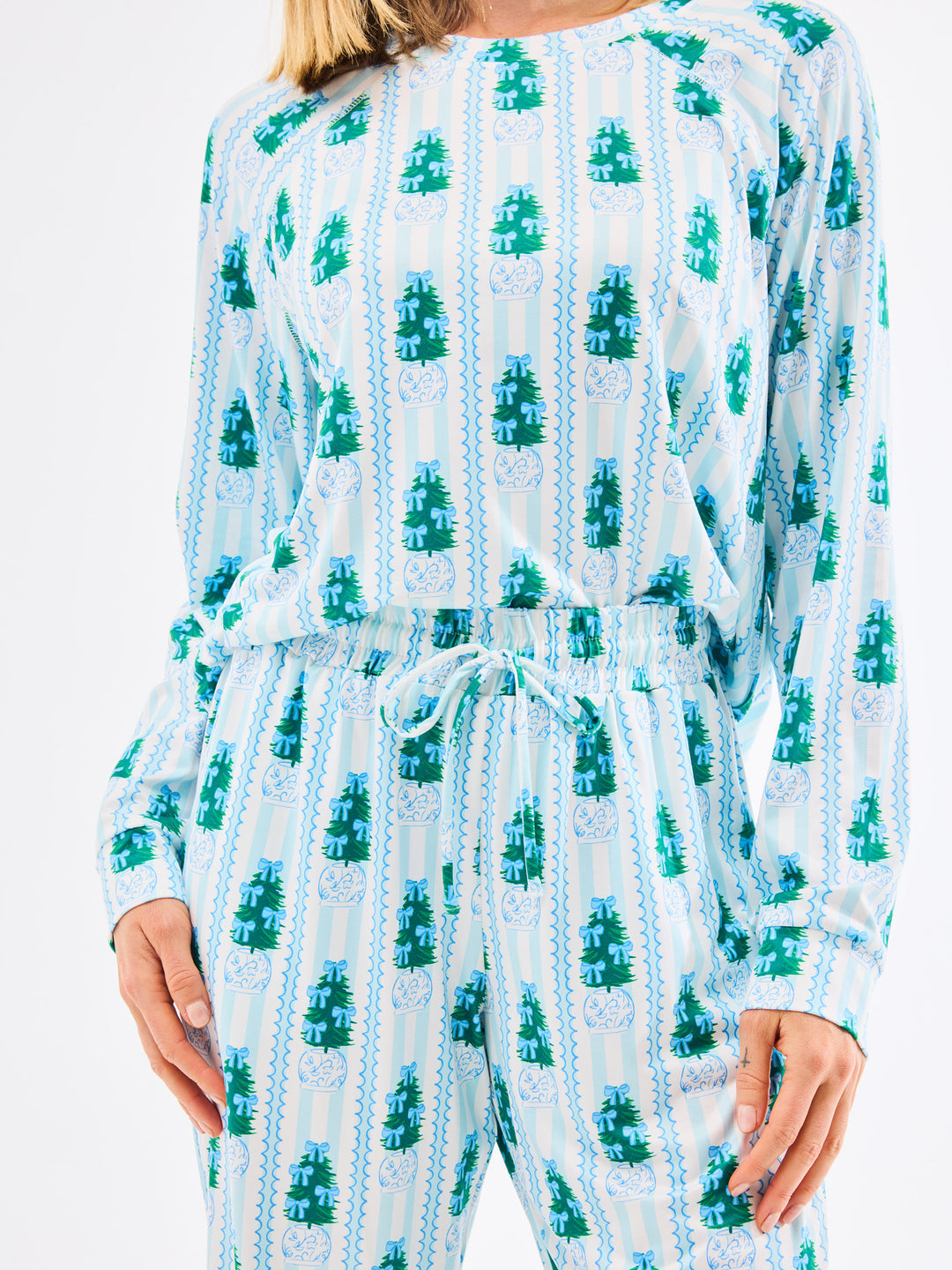 Light blue and green patterned pajamas  worn by a person