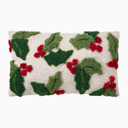 Decorative pillow with holly leaf and berry pattern on a white background