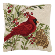 Decorative pillow with a red cardinal and winter elements on a beige background