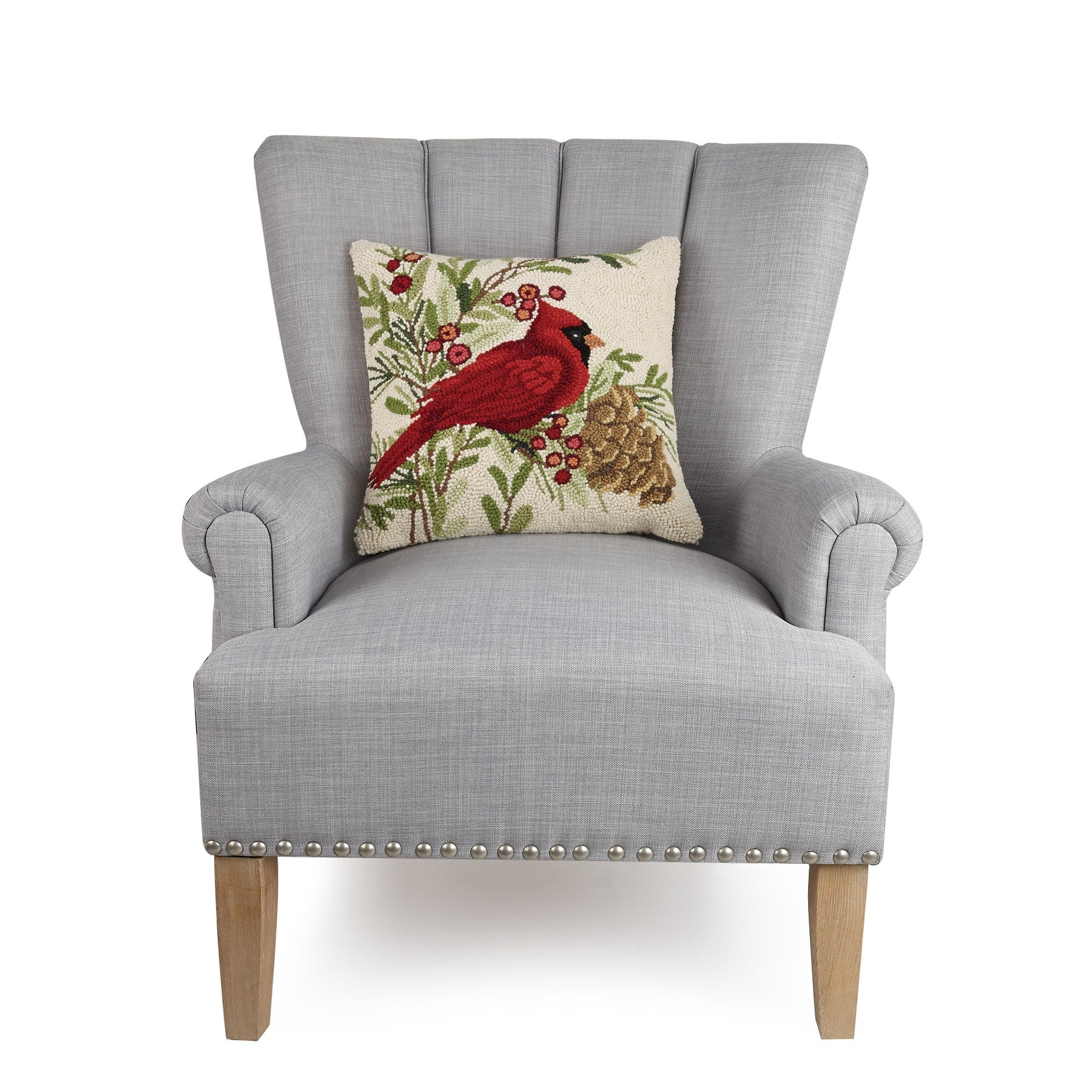 Gray armchair with a decorative pillow featuring a red cardinal on a white background