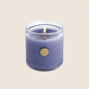 AromatiqueLavender Bouquet Candle 6 oz Blue textured candle with a gold emblem on a beige background 