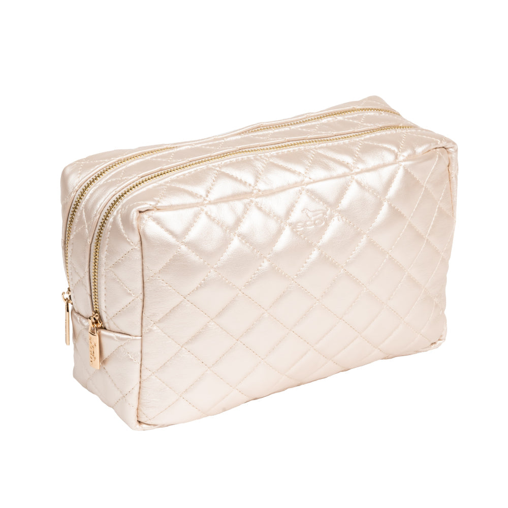 Quilted beige toiletry bag with gold zipper on a white background