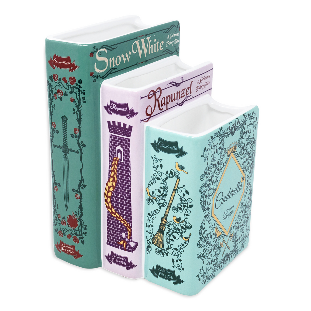Three book-shaped containers with fairy tale characters on a white background