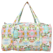 Floral patterned duffel bag on a white background