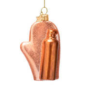 Copper-colored bottle-shaped ornament with a heart design on a white background