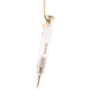 Decorative ornament shaped like a Botox syringe on a white background