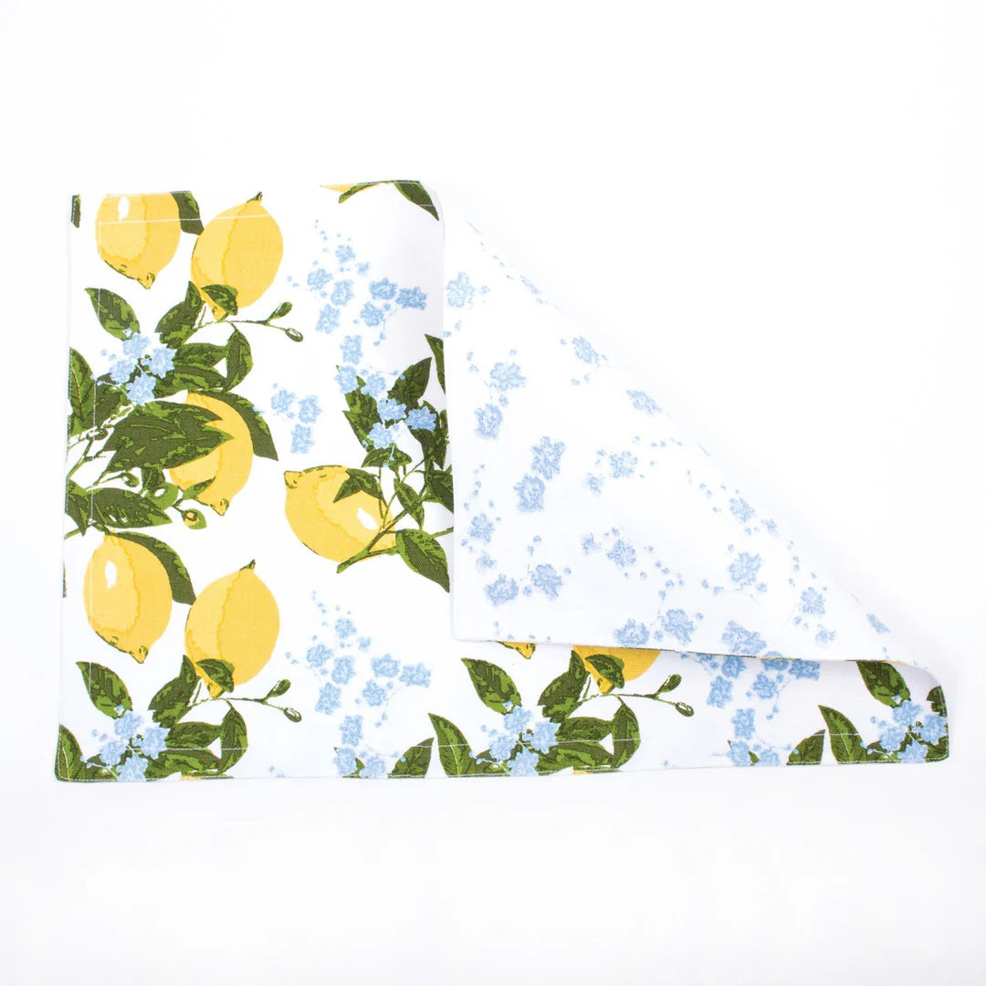 8 Oak Lane Brand reversible placemats with lemon and blue floral patterns on a white background