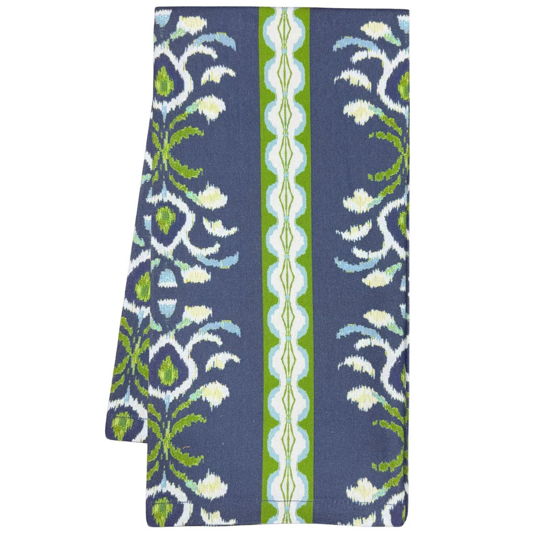 Folded tea towel with blue, green, and white pattern on a white background