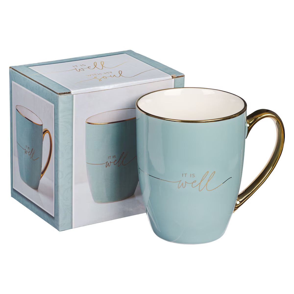 Light blue mug with gold handle and 'it is well' text, in packaging on a white background
