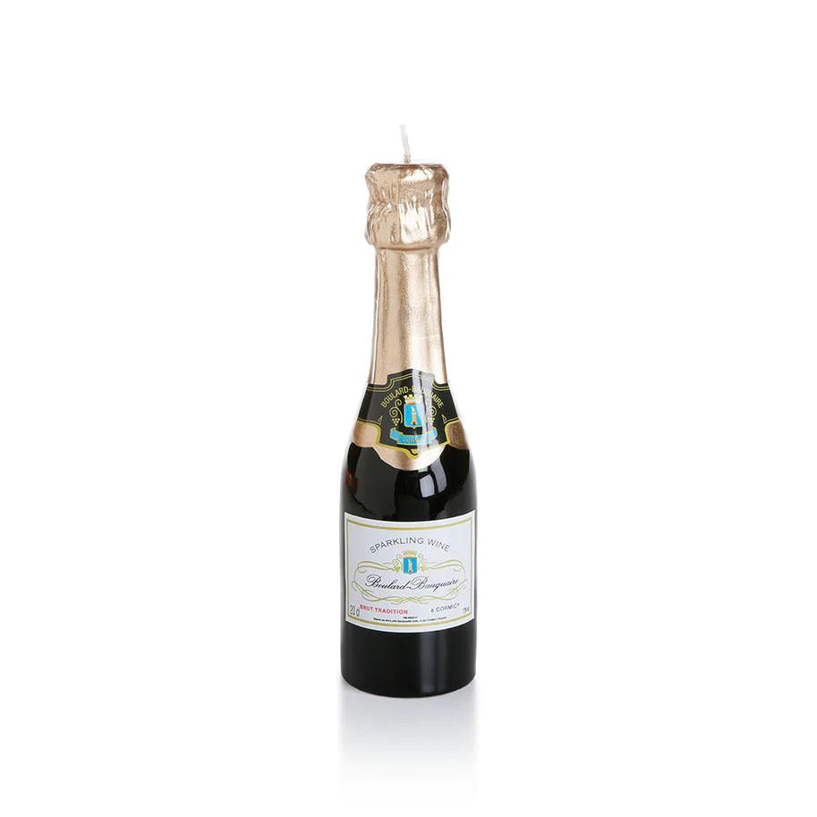 Bottle-shaped candle with a label on a white background