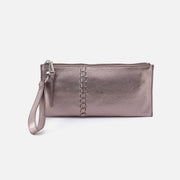 Metallic silver clutch bag with a strap on a white background