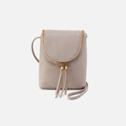 Beige crossbody bag with a strap on a white background