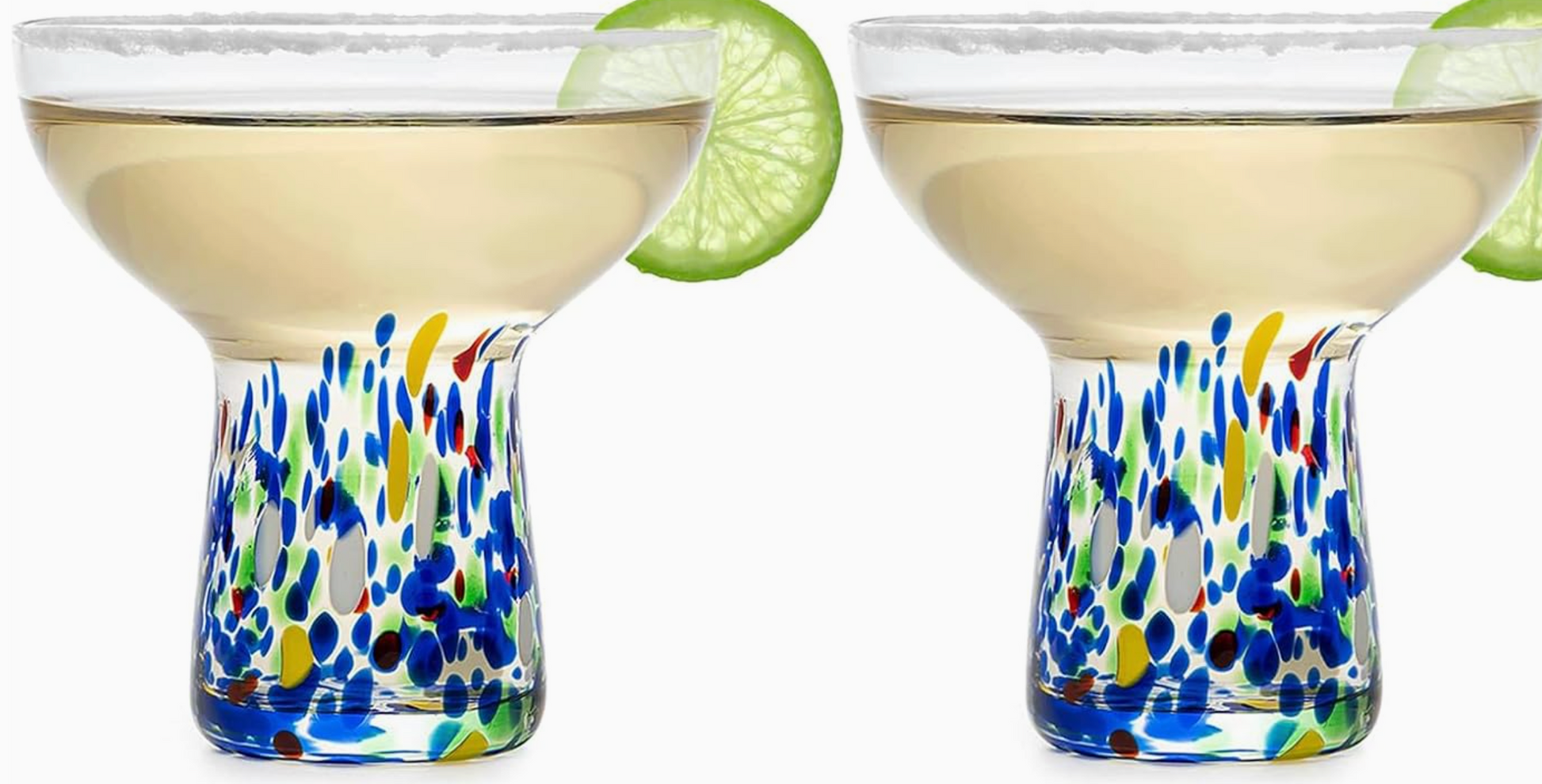 Two glasses with confetti colorful design in the stem and a bolw top with drink and lime slice on white bakground