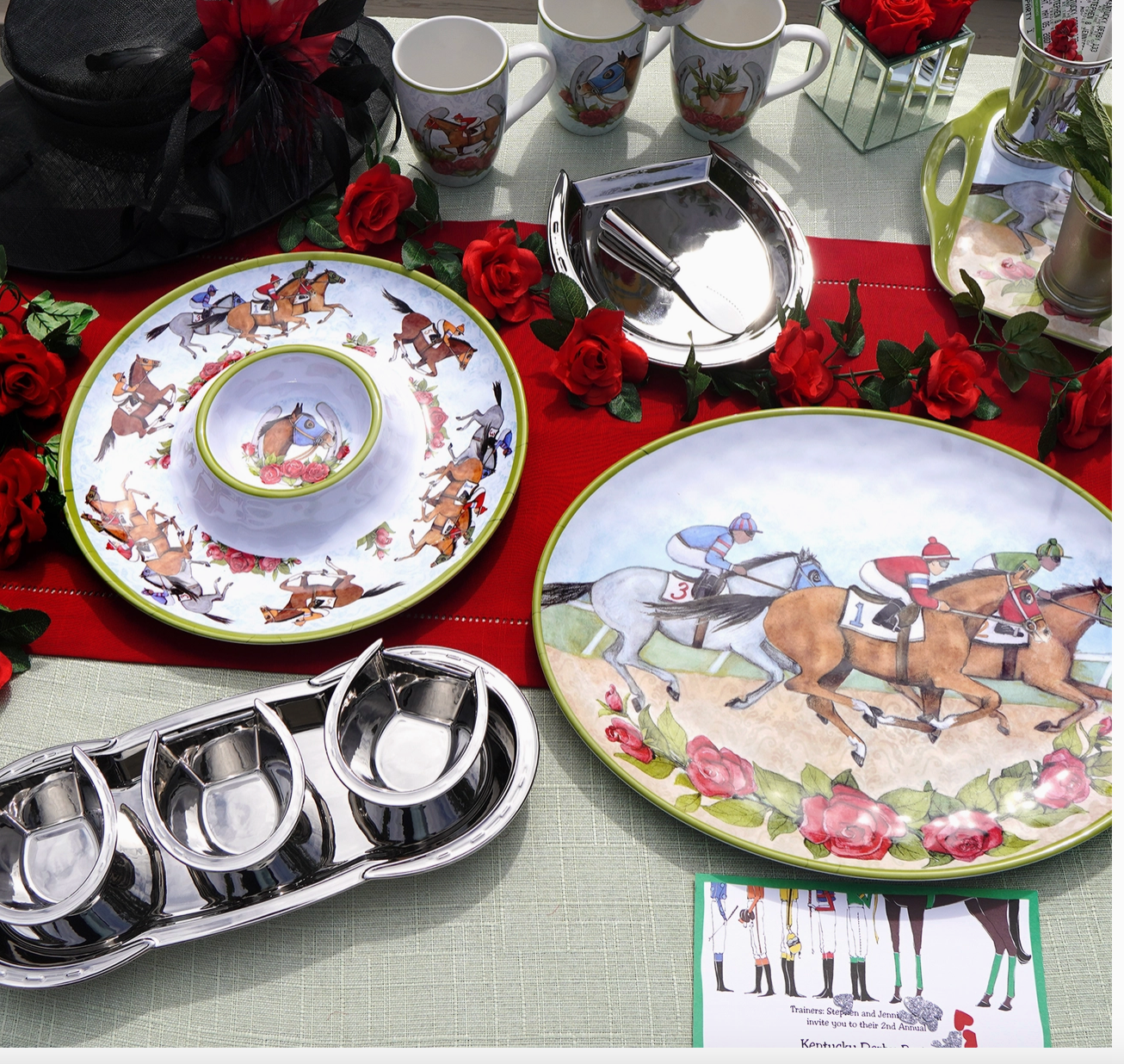 Decorative table setting with horse-themed plates and silverware on a red tablecloth.