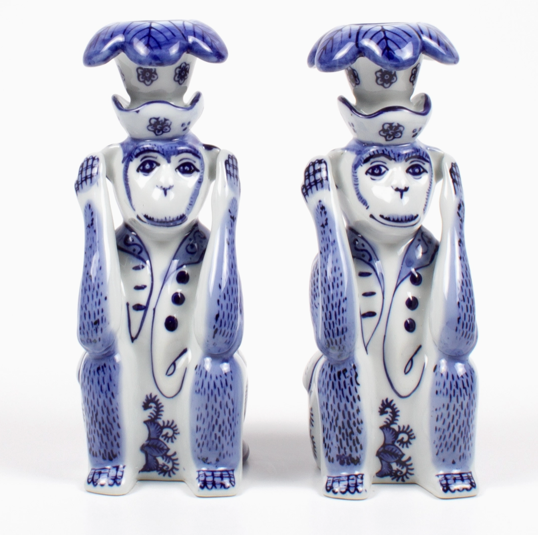 Set of Two 8 Oak Lane ceramic monkey figurine candle holders with blue and white Chinoiserie patterns on a white background
