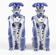 Set of Two 8 Oak Lane ceramic monkey figurine candle holders with blue and white Chinoiserie patterns on a white background