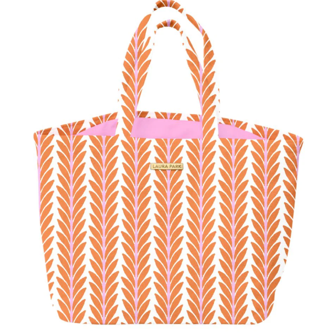 Laura Park Terry Cloth Orange Frond Pattern Tote bag with leaf pattern and pink accents on a white background